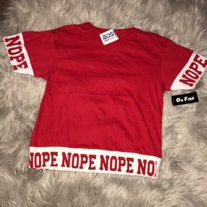 Red shirt that says “NOPE”